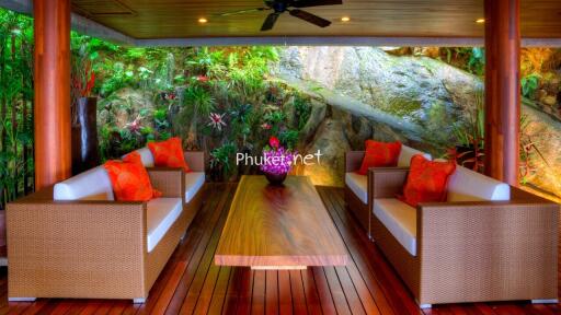 Outdoor living space with comfortable seating and greenery