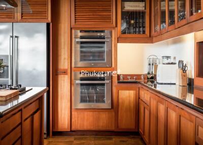 Modern kitchen with wooden cabinets and stainless steel appliances