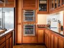 Modern kitchen with wooden cabinets and stainless steel appliances