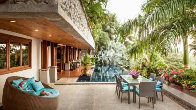 Luxurious outdoor patio with dining area and pool