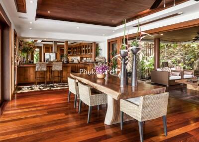 Spacious modern dining room with wooden flooring and elegant decor