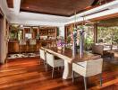 Spacious modern dining room with wooden flooring and elegant decor