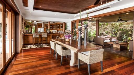 Spacious modern dining room with wooden flooring and elegant decor