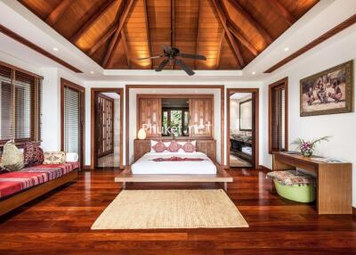 Spacious and luxurious bedroom with wooden ceiling and flooring