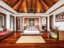 Spacious and luxurious bedroom with wooden ceiling and flooring