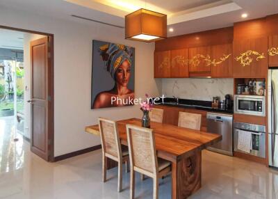 Modern kitchen with dining table and wall art