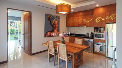 Modern kitchen with dining table and wall art