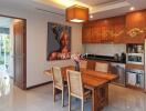 Modern kitchen with dining table and wall art