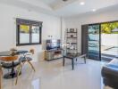 modern living room with dining area and pool view