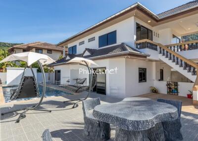 Exterior view of property with pool