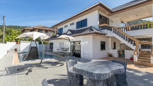 Exterior view of property with pool