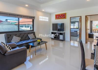 Modern living room with seating area and TV