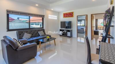 Modern living room with seating area and TV