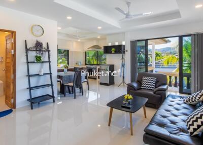 Modern living room with open kitchen and dining area