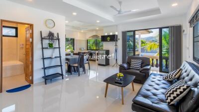 Modern living room with open kitchen and dining area