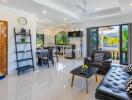 Modern living room with open kitchen and dining area