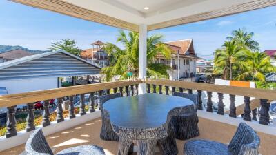 Covered balcony with furniture and view of the neighborhood