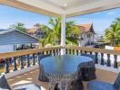 Covered balcony with furniture and view of the neighborhood