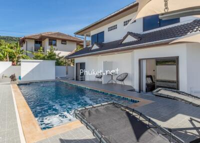 Outdoor view of a house with a swimming pool