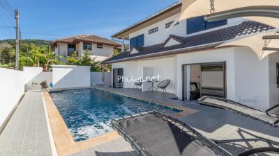 Outdoor view of a house with a swimming pool