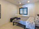 Modern bedroom with a bed, window blinds, AC, ceiling fan, mirror, and side table.