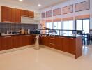 Modern kitchen with wooden cabinets and dining area