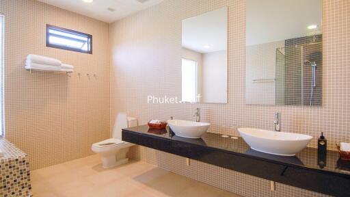 Modern bathroom with dual sinks and large mirror