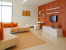 Modern living room with orange accents and wooden wall paneling