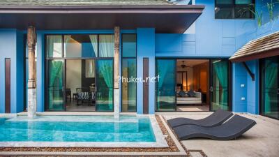 Outdoor pool area with view into living space and bedroom