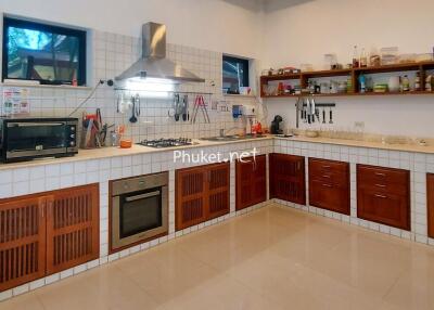 Modern kitchen with wooden cabinets and appliances