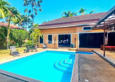 Outdoor area with swimming pool and patio.