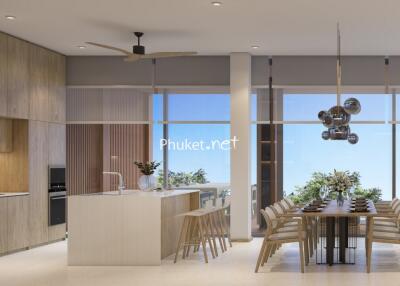 Modern kitchen with island and dining table in a well-lit open space