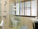 Modern bathroom with glass shower enclosure and large window