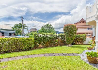 Well-maintained garden with lawn and pathway