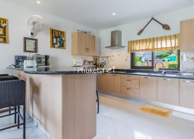 Modern kitchen with bar stools and ample counter space