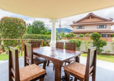 Outdoor patio with wooden dining set