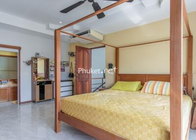 Spacious bedroom with a four-poster bed and en-suite bathroom