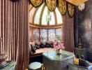 Luxurious living room with large ornate window, elegant curtains, and stylish furniture