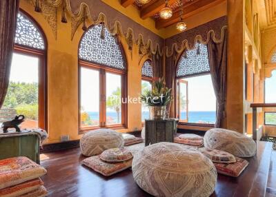 Luxurious living area with a unique ethnic design and ocean view