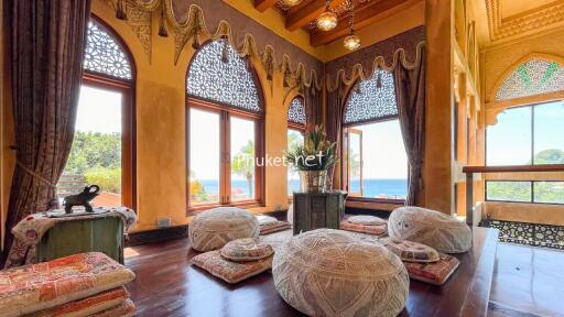 Luxurious living area with a unique ethnic design and ocean view