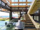 Spacious living room with ocean view and modern staircase