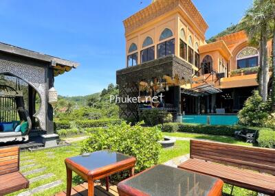 Beautiful garden with a view of a stylish building and lounging area