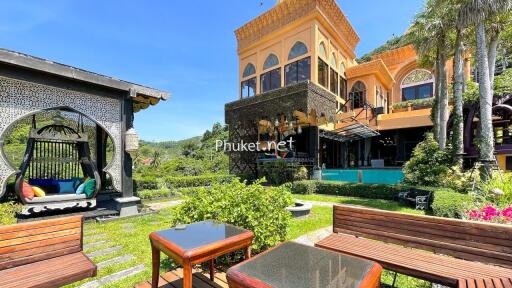 Beautiful garden with a view of a stylish building and lounging area