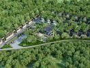 Aerial view of a residential development surrounded by greenery