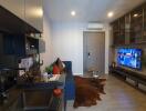 Modern living room with entertainment center and kitchenette