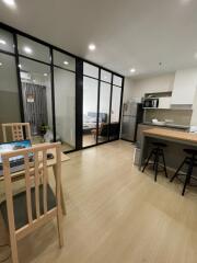 Modern open-plan living area with kitchen and dining space