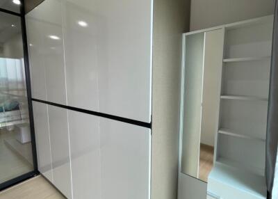 Bedroom with large wardrobe and mirror cabinet