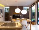 Modern kitchen and dining area with view of private swimming pool