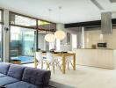 Modern kitchen with dining area and pool view