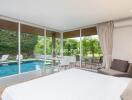 Modern bedroom with a view of the backyard pool